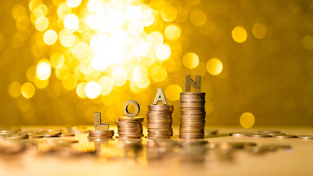 istock Word loan on stack of coins 1344711030