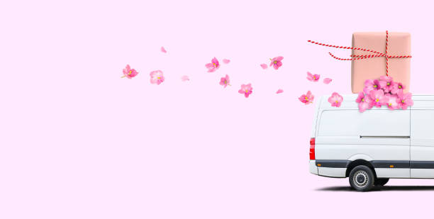 istock Delivery van with flowers and parcel on a pink background. 1344714661