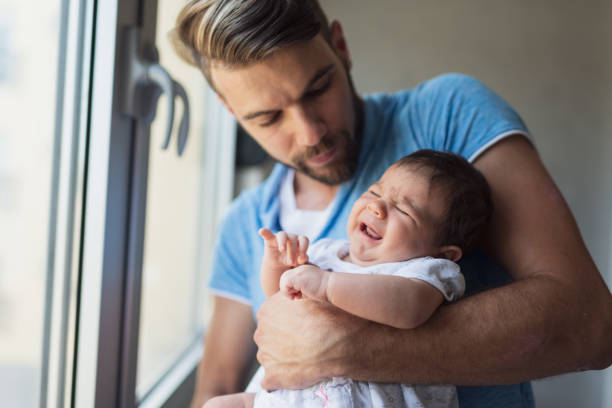 istock Father consoling little baby 1344714968