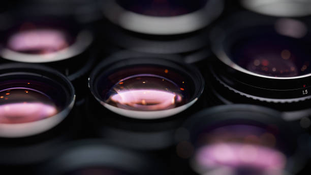 High-aperture camera lenses with reflections, low key image. High-quality photographic lens close photographed.