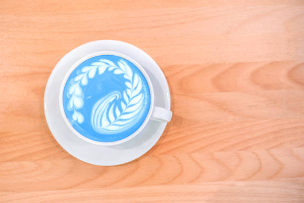 istock Fresh flavored blue matcha art on wooden background. 1344716125