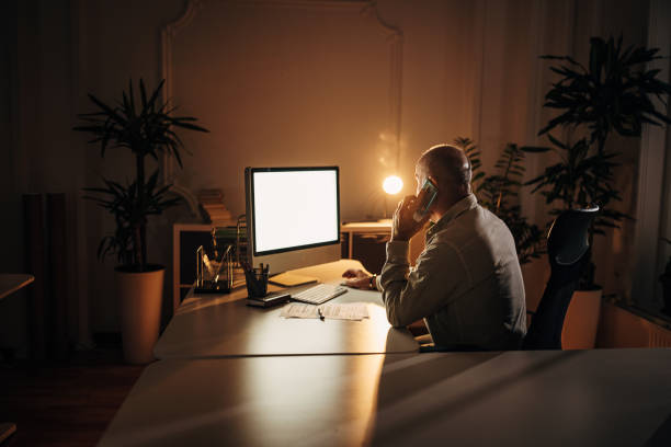 istock Mature man working late in office 1344716604