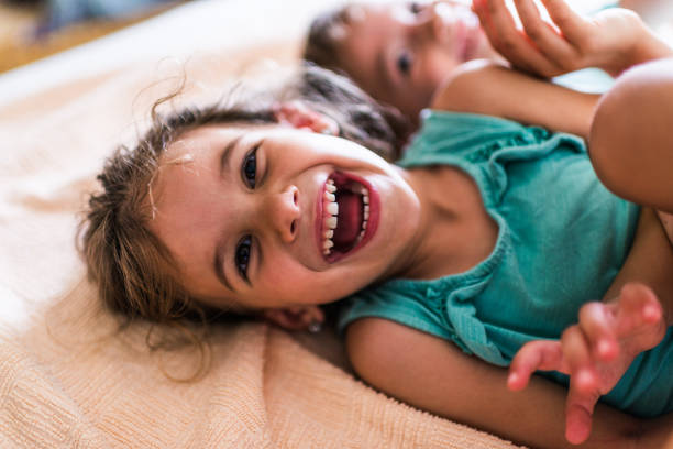 istock Beautiful children playing on the bed 1344717645