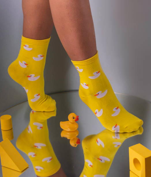 istock Woman wearing stylish socks with duck pattern 1344719570