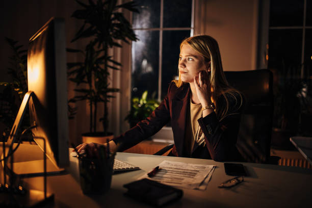 istock Business woman working late in office 1344719877
