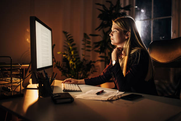 istock Business woman working at night in office 1344722048