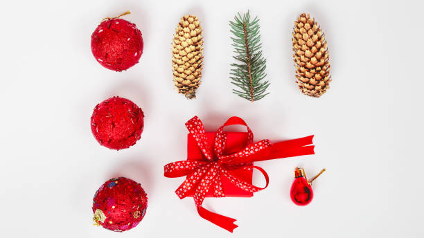 istock Christmas composition. Gifts, spruce branches, red decorations on a white background. Christmas, winter, new year concept. Flat lay 1344725212