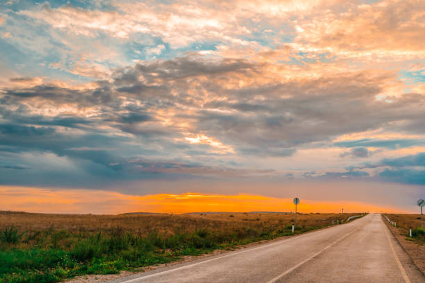 istock Amazing highway landscape at dawn with dramatic sky 1344725522