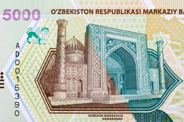 istock Sherdor Madrasasi in Samarkand from Uzbekistani money 1344728131