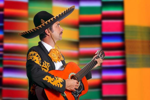 istock Charro Mariachi playing guitar serape poncho 1344728591