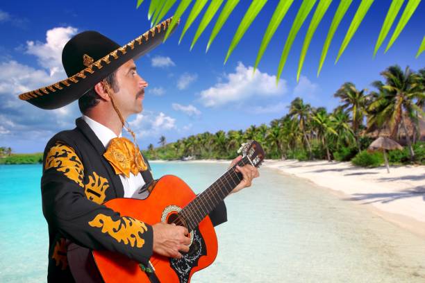 istock Charro mexican Mariachi playing guitar in beach 1344728609