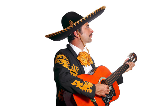 Charro mexican Mariachi playing guitar isolated on white