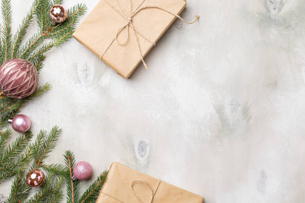 istock Table with Christmas composition with gift, decorations, fir tree branches on wooden background. Flat lay, top view 1344729475