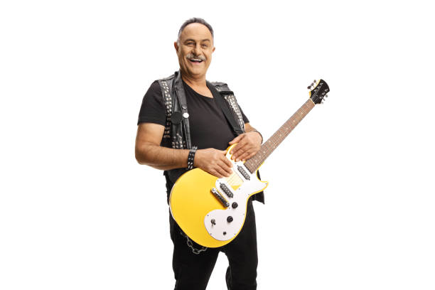 istock Mature rocker with an electric guitar smiling at camera 1344729729
