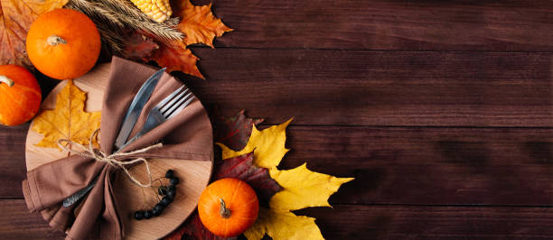 istock Thanksgiving cutlery setting. Festive table decor on wooden background. 1344730621