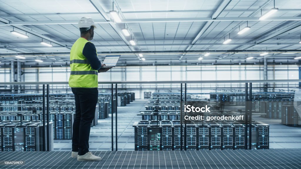 Vests Computers Data Center Engineer In High Visibility Vest Using Laptop Computer ...