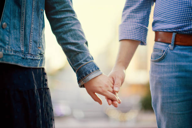 istock Caucasian man and woman holding hands 1344733535
