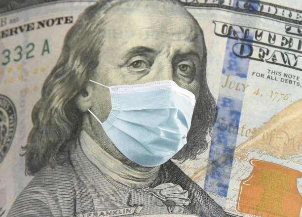 istock One hundred dollar banknote with face mask, closeup 1344733891