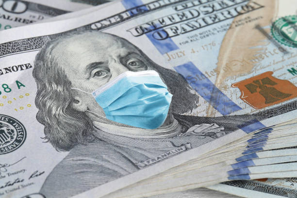 istock One hundred dollar banknote with face mask, closeup 1344734649