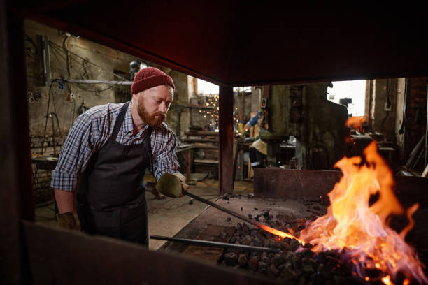istock Man burning the flame in the furnace 1344735357