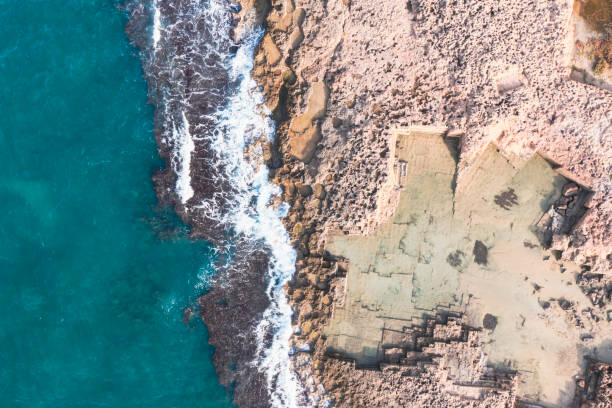 istock Aerial view of waves splashing on beach 1344735957