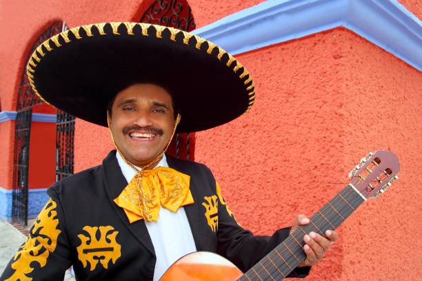 istock Charro Mariachi playing guitar Mexico houses 1344738793