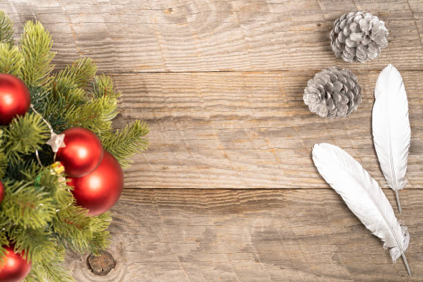 istock Christmas concept with tree, baubles, feathers and pine cones 1344741235