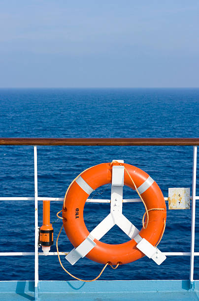 istock Red Lifebuoy - Blue Sea 134474240