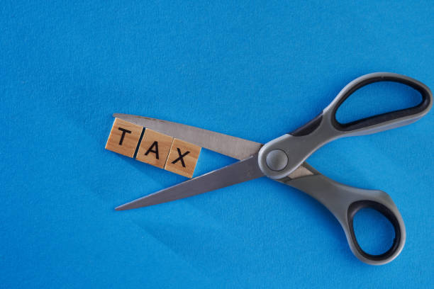 istock single word tax and scissors 1344742440