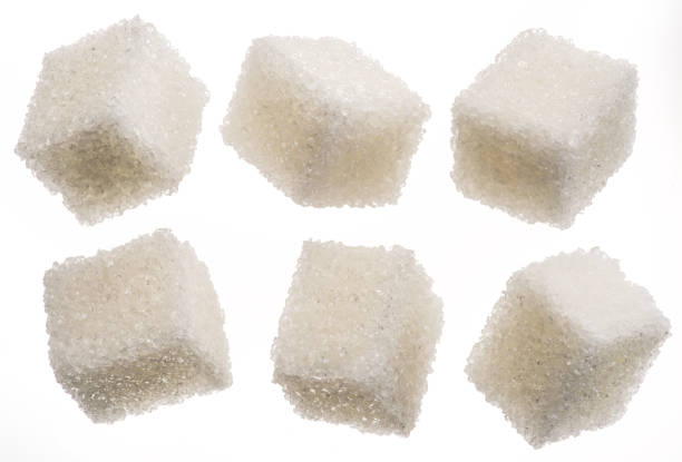 istock White sugar cubes on white background. Macro picture. 1344743461