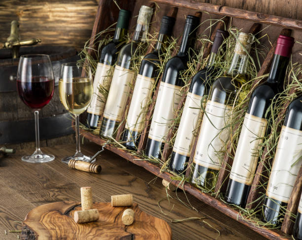 istock Wine bottles on the wooden shelf. 1344743764