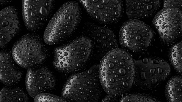 istock Black Stones.rock background and water drop 1344744955