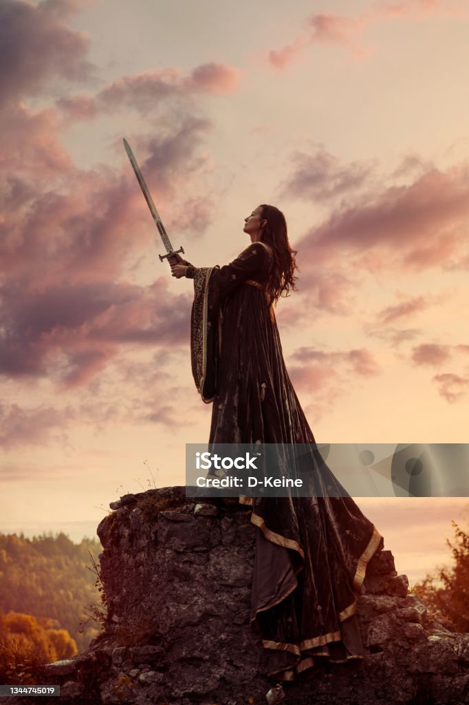 Knight Portrait of woman knight holding big sword Fantasy Stock Photo
