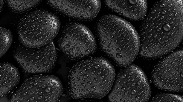 istock Black Stones.rock background and water drop 1344745327