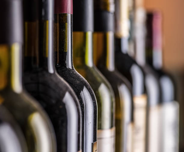 istock Line of wine bottles. Close-up. 1344745626