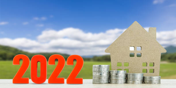 istock House model and stack of coins with landscape 1344745718