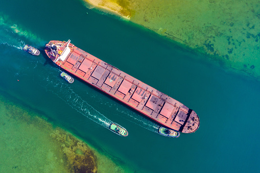 Aerial view of a heavy loaded container cargo vessel