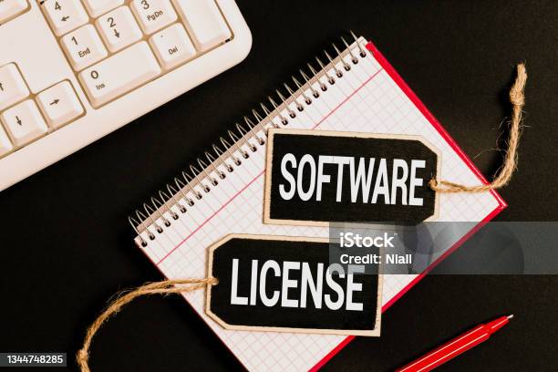 Inspiration Showing Sign Software License Business Approach Legal Instrument Governing The Redistribution Of Software Typing And Writing New Ideas Browsing Internet And Taking Important Notes Stock Photo - Download Image Now
