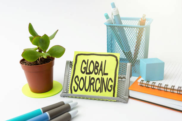 istock Conceptual display Global Sourcing. Concept meaning practice of sourcing from the global market for goods Tidy Workspace Setup Writing Desk Tools And Equipment Taking Notes 1344748471