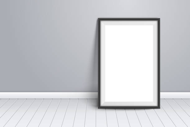 istock Minimalist mockup template on wall. Black picture frame stand on wooden floor in room. Template for photography presentation. Empty board photoframe 1344748857