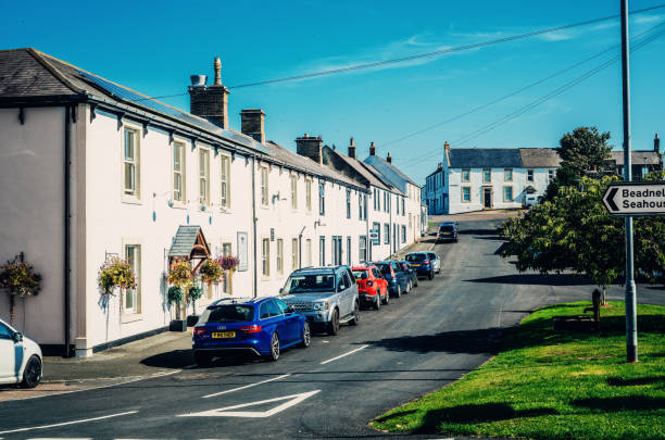 Embleton, England - September, 08 2021: Looking east along Front Street in the village of Embleton in the Northumberland region of England.