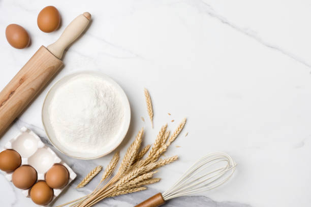 istock Baking ingredients for homemade cake on marble table top view 1344752829
