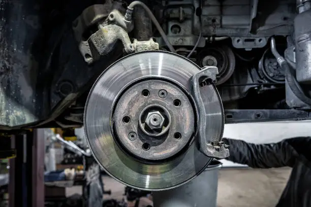 Photo of Car brake disc without wheels closeup