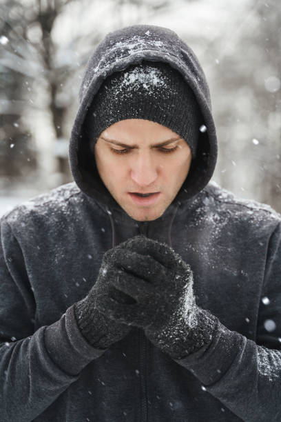 istock Handsome athletic man wearing hoodie during his winter workout 1344753791