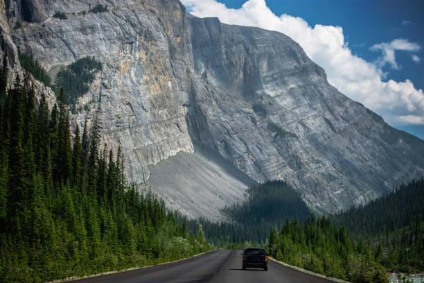istock Driving on a road in the mountains 1344754282