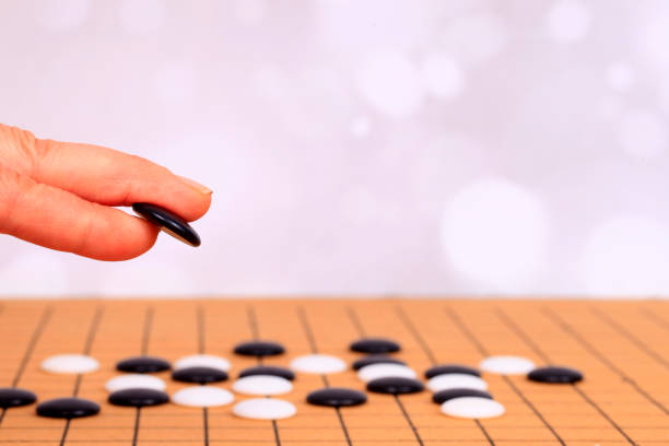 istock chinese game go,  Gobang and go game board 1344755556