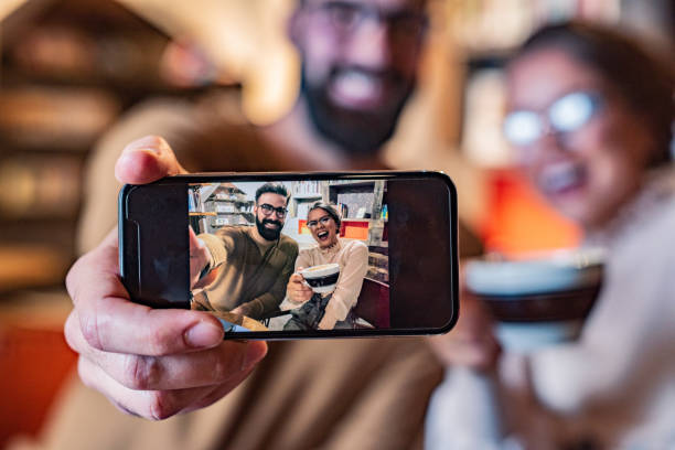 istock Young couple taking a selfie whit mobile phone 1344757290