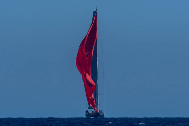 istock Maxi yacht is shifiting red gennaker on the sea 1344757449