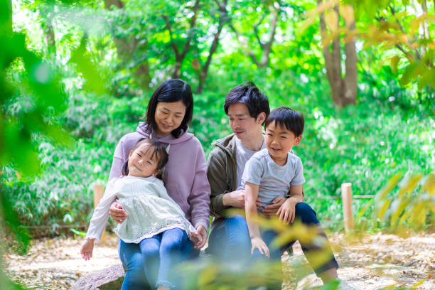 istock Family playing in the forest 1344759262