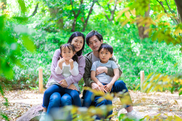 istock Family playing in the forest 1344759269